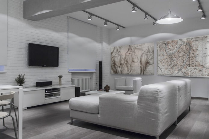 arredamento e illuminazione nel soggiorno nei toni del bianco