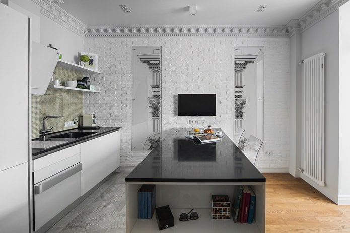 cucina a isola con piano di lavoro nero lucido