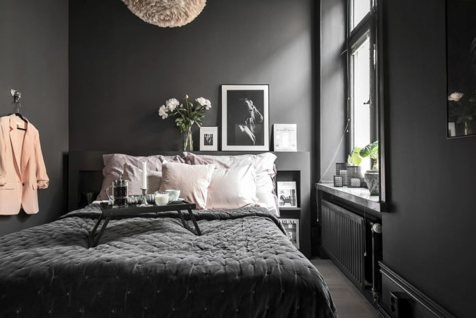 arredamento e illuminazione della camera da letto nei toni del nero