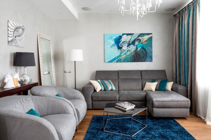 modello di divano con pouf grigio all'interno