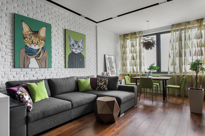 modello di divano con pouf all'interno del soggiorno