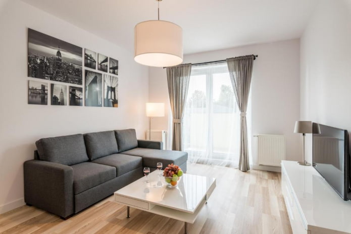 modello di divano con pouf all'interno dell'ingresso