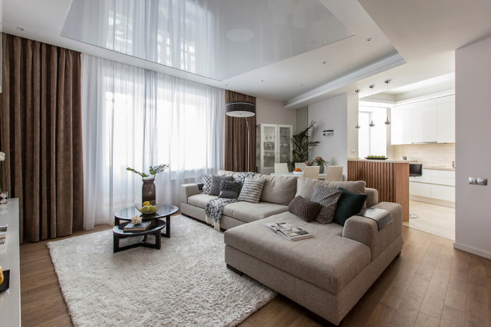 modello di divano con pouf nell'arredamento del soggiorno