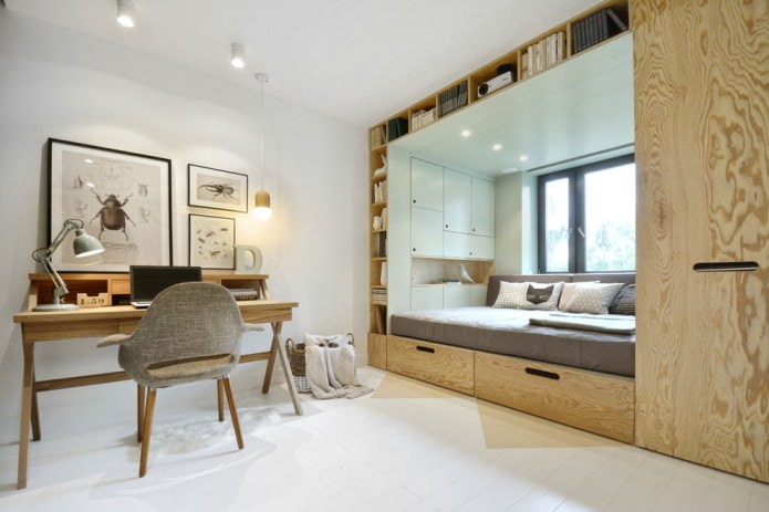 letto con cassetti incorporati vicino alla finestra in una piccola cameretta dei bambini