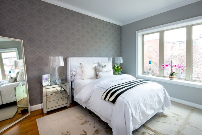 Pareti grigie in camera da letto in stile scandinavo
