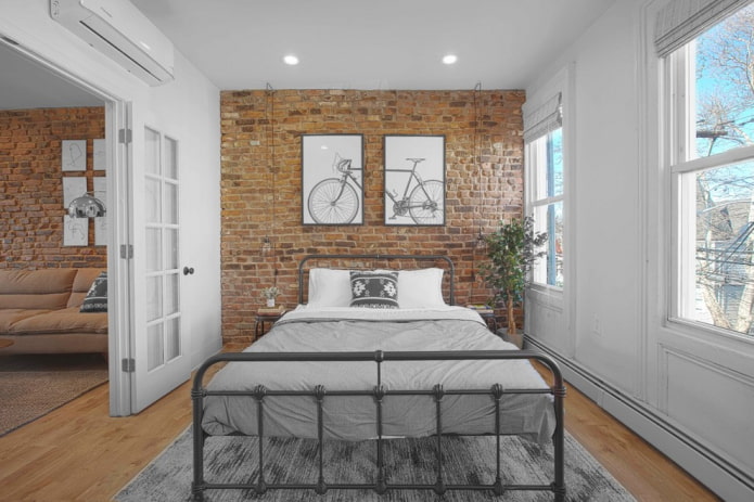 letto forgiato in una camera da letto in stile loft