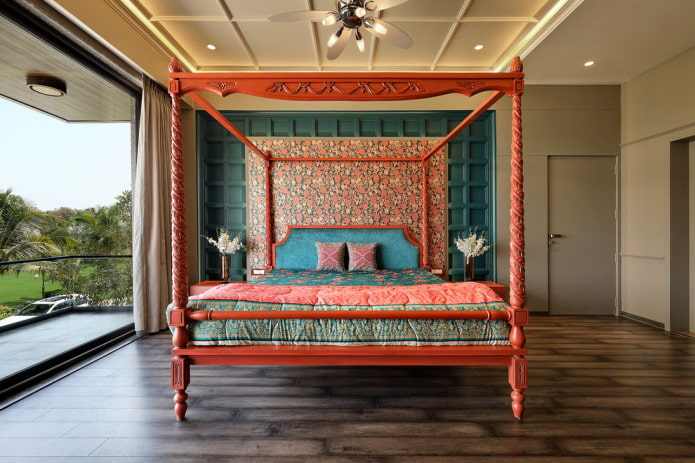 letto rosso all'interno della camera da letto