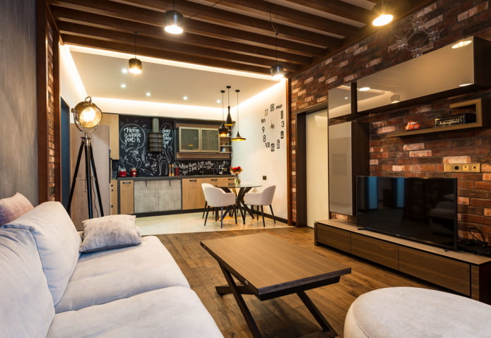 organizzazione dell'illuminazione all'interno della cucina-soggiorno