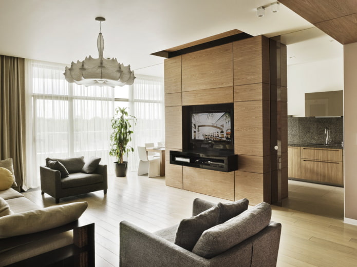 parete divisoria con TV all'interno della cucina-soggiorno
