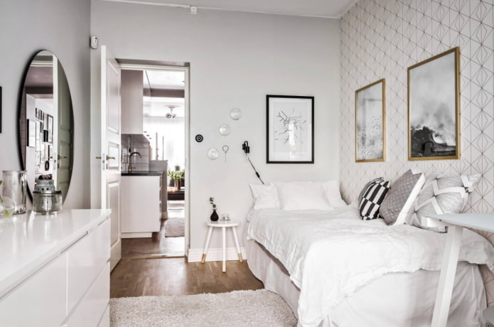carta da parati con motivo geometrico vicino al letto