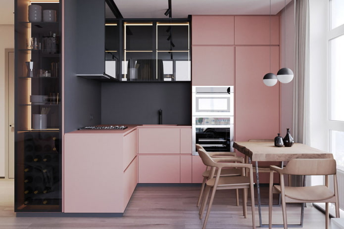 mobili ed elettrodomestici nell'interno della cucina nei toni del rosa