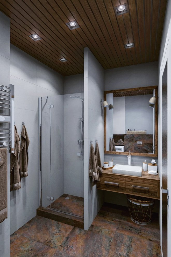 interno del bagno nei toni del grigio-marrone