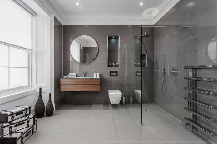 interno di un bagno moderno con piastrelle grigie rettangolari