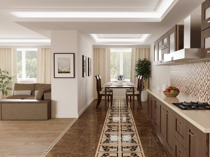 una combinazione di laminato e piastrelle sul pavimento nella cucina-soggiorno