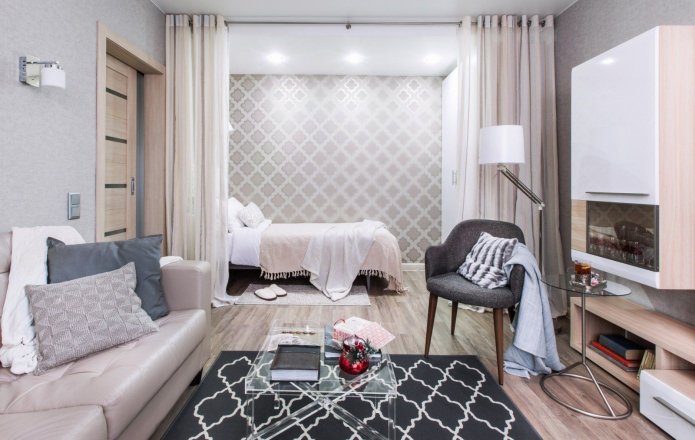 zonizzazione con tende all'interno della camera da letto-soggiorno