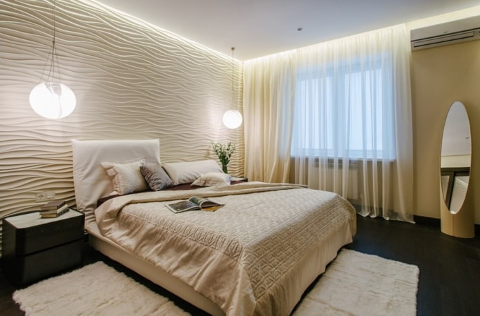 arredamento e illuminazione all'interno di una camera da letto beige
