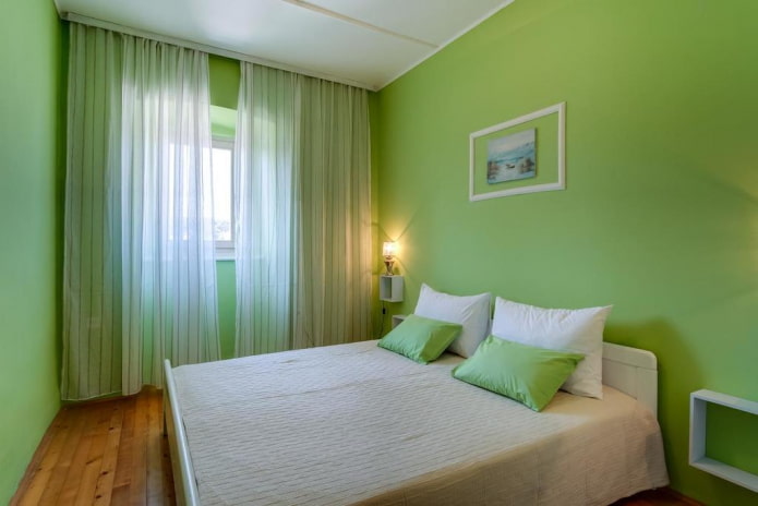 interno della camera da letto nei toni del verde chiaro