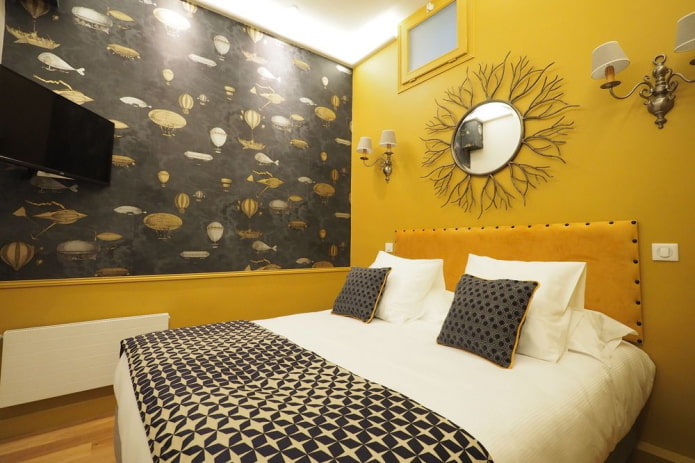 decorazione e illuminazione nell'interno della camera da letto nei toni del giallo