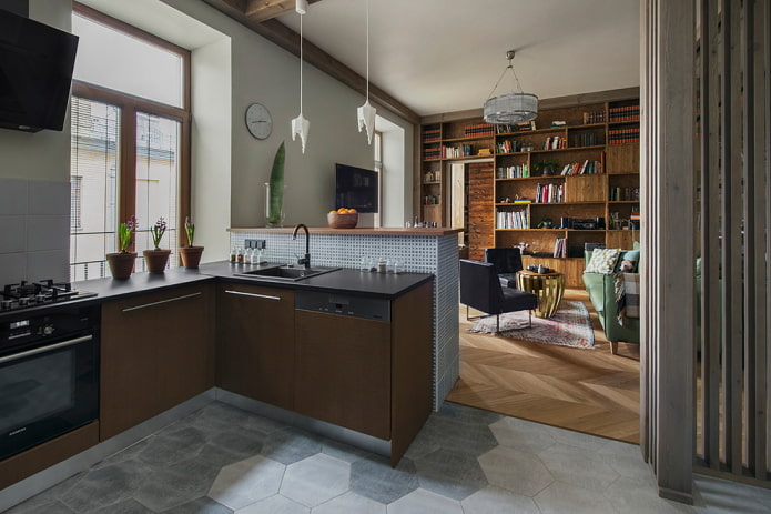 zonizzazione con materiali di finitura all'interno della cucina-soggiorno